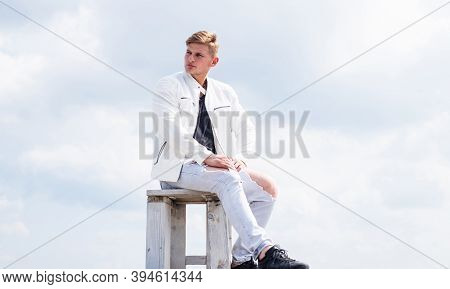 Be Your Own Compass. Single Guy Sit On Chair Cloudy Sky. Enjoying Rest. Summer Vacation. Travel And 
