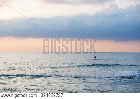 Sapboarder Floats On The Black Sea In Sochi, Russia