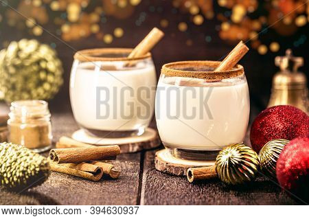 Hot Christmas Drink With Decoration And Christmas Lights In The Background, Called Eggnog, Made With