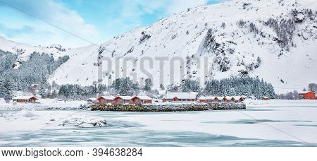 Winter Scene With Traditional Norwegian Red Wooden Houses On The Shore Of Rolvsfjord In Valberg On V
