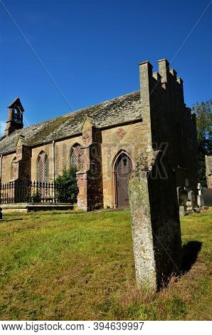 An Exterior View Of The Old Stone Church Building And Tithe Barn In The Borders Village Of Foulden I