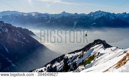 Winter Landscape Of Snow Covered Mountains With Fog In Sunset. Rochers De Naye In Switzerland. Tranq