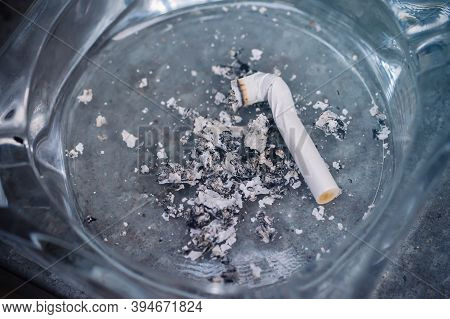 Cigarette Butt In An Ashtray Close-up, Top View