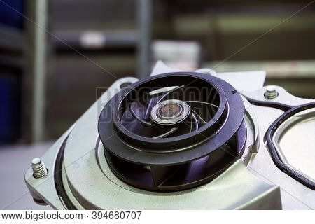 Coolant Pomp Of A Modern Car. The Pump Impeller Is Shown In Close-up.
