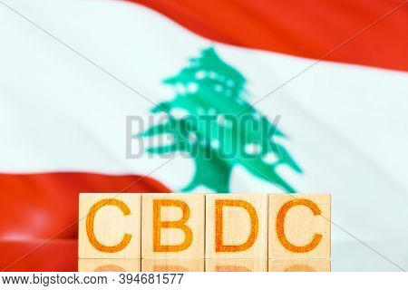 Cbdc Lebanon. Wooden Cubes With The Inscription Cbdc On The Background Of The National Flag Of Leban