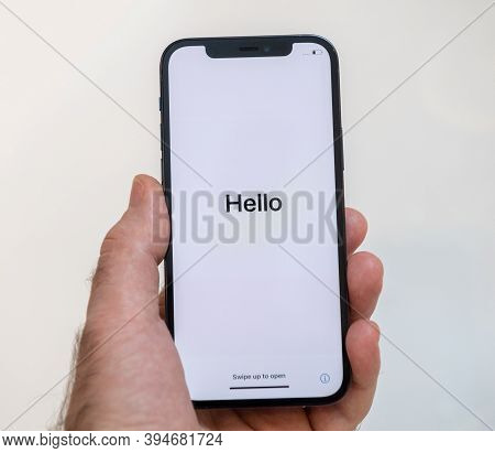 Paris, France - Nov 11, 2020: Hello Word In As Man Hand Holding New Iphone 12 Pro Max 5g Smartphone 