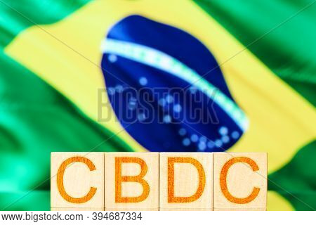 Cbdc Brazil. Wooden Cubes With The Inscription Cbdc On The Background Of The National Flag Of Brazil
