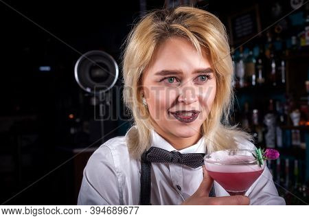 Expert Girl Bartending Demonstrates The Process Of Making A Cocktail At The Night Club
