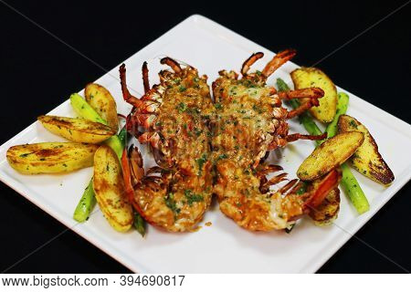 Lobster Thermidor Served With Glazed Potato And Asparagus In A Platter