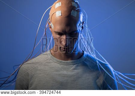 Man With Electrodes In His Head Is A Futuristic Concept Of Virtual Reality And Mind Control. Neuro I