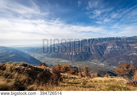 Adige Valley And Monte Baldo (baldo Mountain) With Lake Garda On The Horizon, From The Mountain Peak