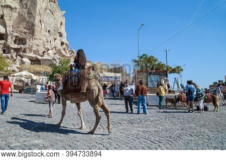 Uchisar, Turkey - October 4, 2020: This Is A Camel And Pony Ride On The Square In Front Of The Rocky