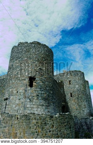 Harlech Castle, Wales. Dramatic, Imposing, Defensive Walls With Two Towers.vertical Shot, Blue Sky B