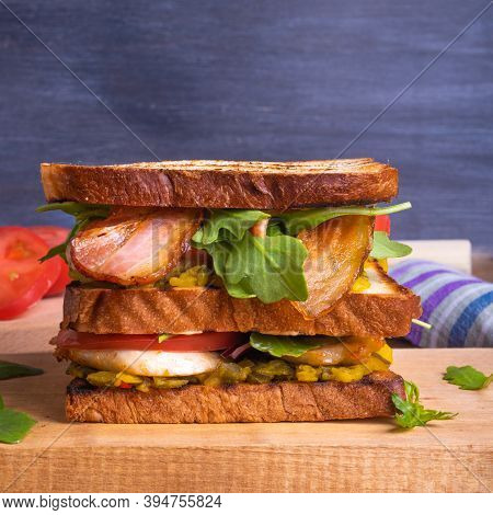 Large Delicious Homemade Square Sandwich With Chicken Breast, Bacon, Salad And Vegetables
