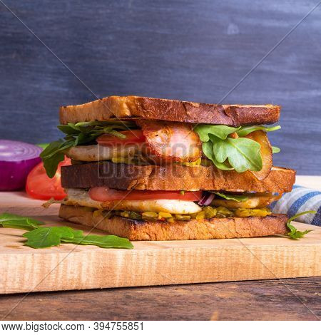 Large Delicious Homemade Square Sandwich With Chicken Breast, Bacon, Salad And Vegetables
