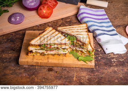 Large Delicious Homemade Square Sandwich With Chicken Breast, Bacon, Salad And Vegetables