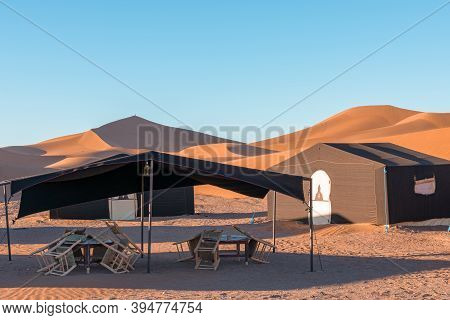 Desert Camp In Dunes Of Erg Chigaga, At The Gates Of The Sahara. Morocco. Concept Of Travel And Adve
