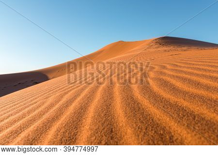 Daytime Close-up Desert Dunes Of Erg Chigaga, At Sahara. Morocco. Concept Of Travel And Adventure.
