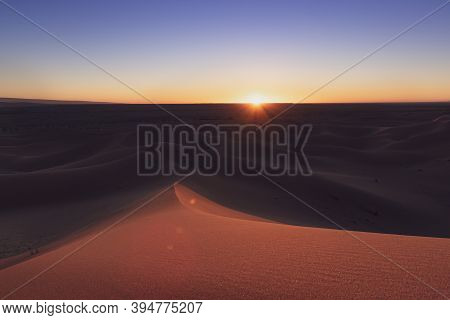Huge Desert Dunes Of Erg Chigaga, At The Gates Of The Sahara, At Sunset. Morocco. Concept Of Travel