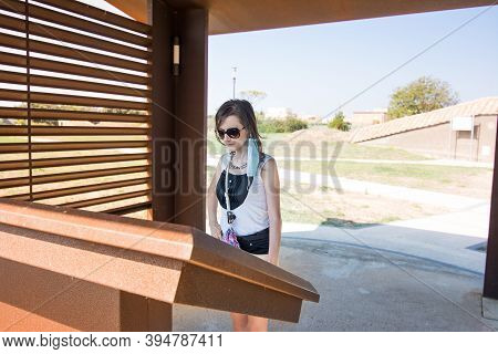 Tarquinia, Italy - 18 September 2020: Tourist Reads Information In The Necropolis Of Tarquinia.