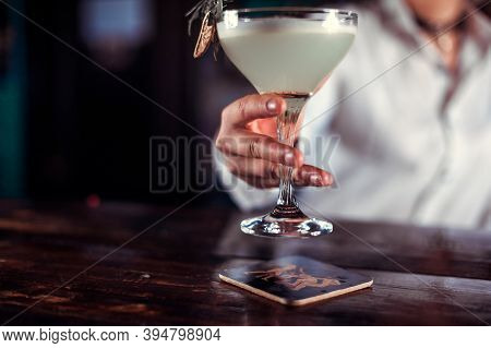 Girl Bartender Mixes A Cocktail In The Porterhouse