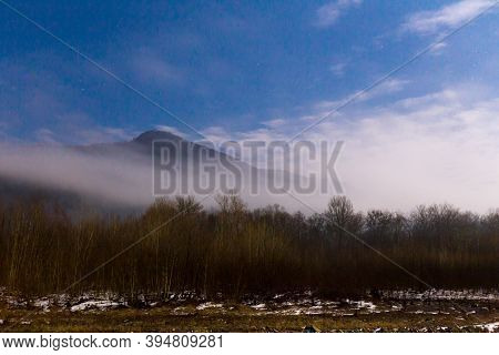 Beautiful Landscape With Cloudy Mountain At Twilight