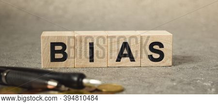 The Inscription Bias On The Texture Of Wooden Cubes On The Background Of Manet. An Inscription On A 