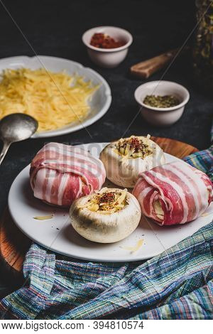 Preparing Of Bacon-wrapped Button Mushrooms Stuffed With Grated Cheddar Cheese And