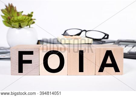 Foia, Text On Wood Cubes On Light Background, Business Concept