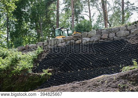 Selective Focus, Security Concept. Strengthening The Mountain Slope With Construction Equipment, Art