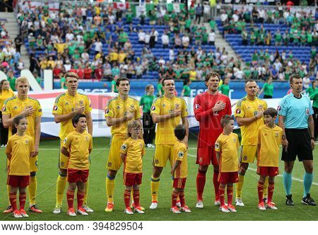 Lyon, France - June 16, 2016: Players Of Ukraine National Football Team Listen To National Anthem Be