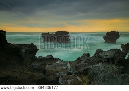 Picturesque Seascape. Amazing Landscape. Rock In The Ocean. Motion Waves. Silky Water. Long Exposure