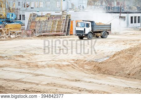 Multi-ton Heavy Mining Dump Truck Loaded With Cargo During Removal Of Construction Soil From Constru