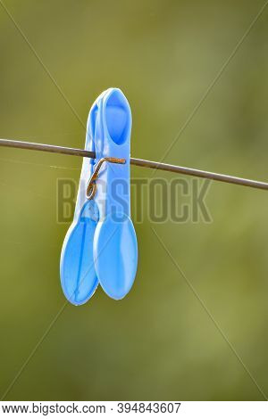 Blue Plastic Cloth Peg On A Washing Line