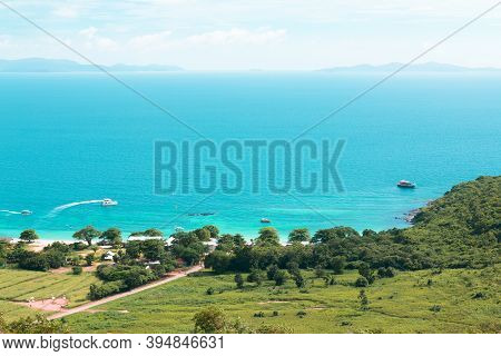 Aerial View From Koh Larn Of Thailand Overlooks The Sea During Day Time Amongst The Blue Sky. Koh La
