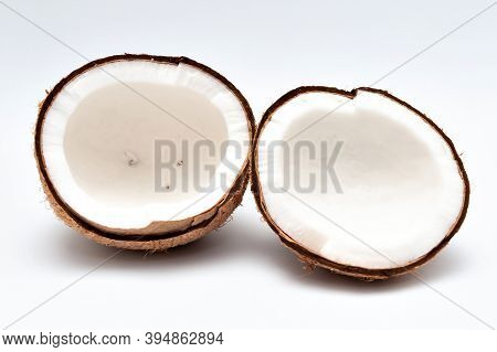 Healthy Food - Halved Coconut Isolated On White Background.
