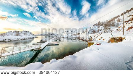 Charming Winter Scenery With Yachts And Boats Nier Pier In Small Fishing Village And Snowy  Mountain