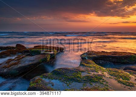 Beautiful Seascape. Beach With Stones Covered By Seaweeds. Low Tide. Composition Of Nature. Motion W