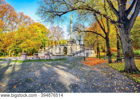Charming Autumn View Of Angel Of Peace (friedensengel) Monument. Statue Of A Golden Angel On A Colum