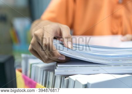 Office Workers Employee Holding Stacks Of Lot Documents Report Papers Waiting Be Managed On Desk In 