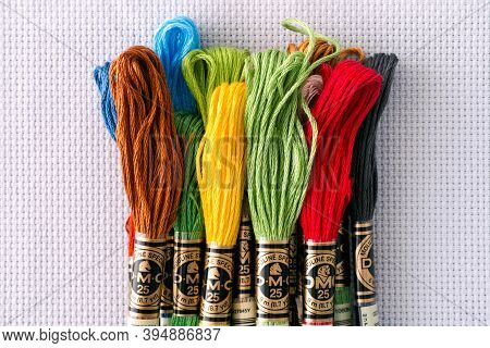 Tambov, Russian Federation - October 20, 2020 Pile Of Different Colors Dmc Six Strand Floss On White