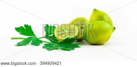 Photo Of Limequats With Greens, Beautiful Composition Of Small Citrus Fruits On White Isolated Backg