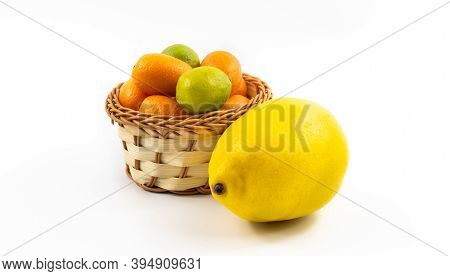 Small Wicker Basket With Kumquats And Limequats, Exotic Citrus Fruits In Winter On White Isolated Ba