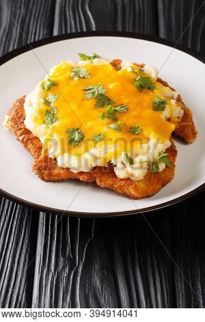 English Fast Food Parmo With Chicken Fillet Breaded With Bechamel Sauce And Cheddar Cheese Close-up