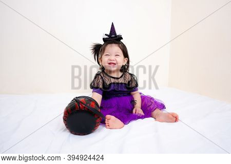 Asian Thai Cute Baby Girl In Witch Costume, Halloween Day