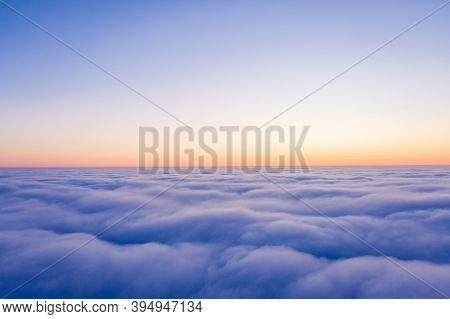 Arial view from plane on the sunrise sky, beautiful cloudy sky panoramic view