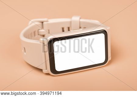Mockup Fitness Watch On Pastel Background. Close-up. Front View Of Pink Smartwatch With Blank White 