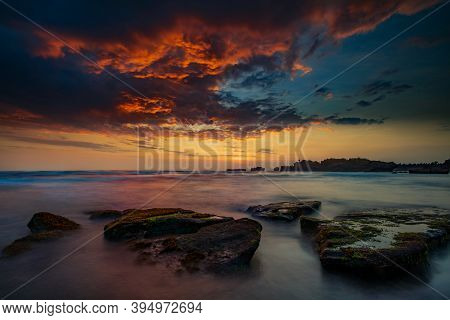 Calm Ocean Long Exposure. Stones In Mysterious Mist Of The Sea Waves. Concept Of Nature Background. 