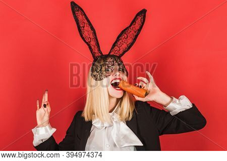 Easter Celebration. Sensual Woman Wearing Black Lace Easter Rabbit Ears With Carrot. Sexy Easter Bun
