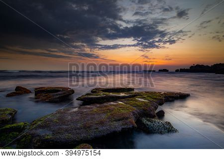 Calm Ocean Long Exposure. Stones In Mysterious Mist Of The Sea Waves. Concept Of Nature Background. 
